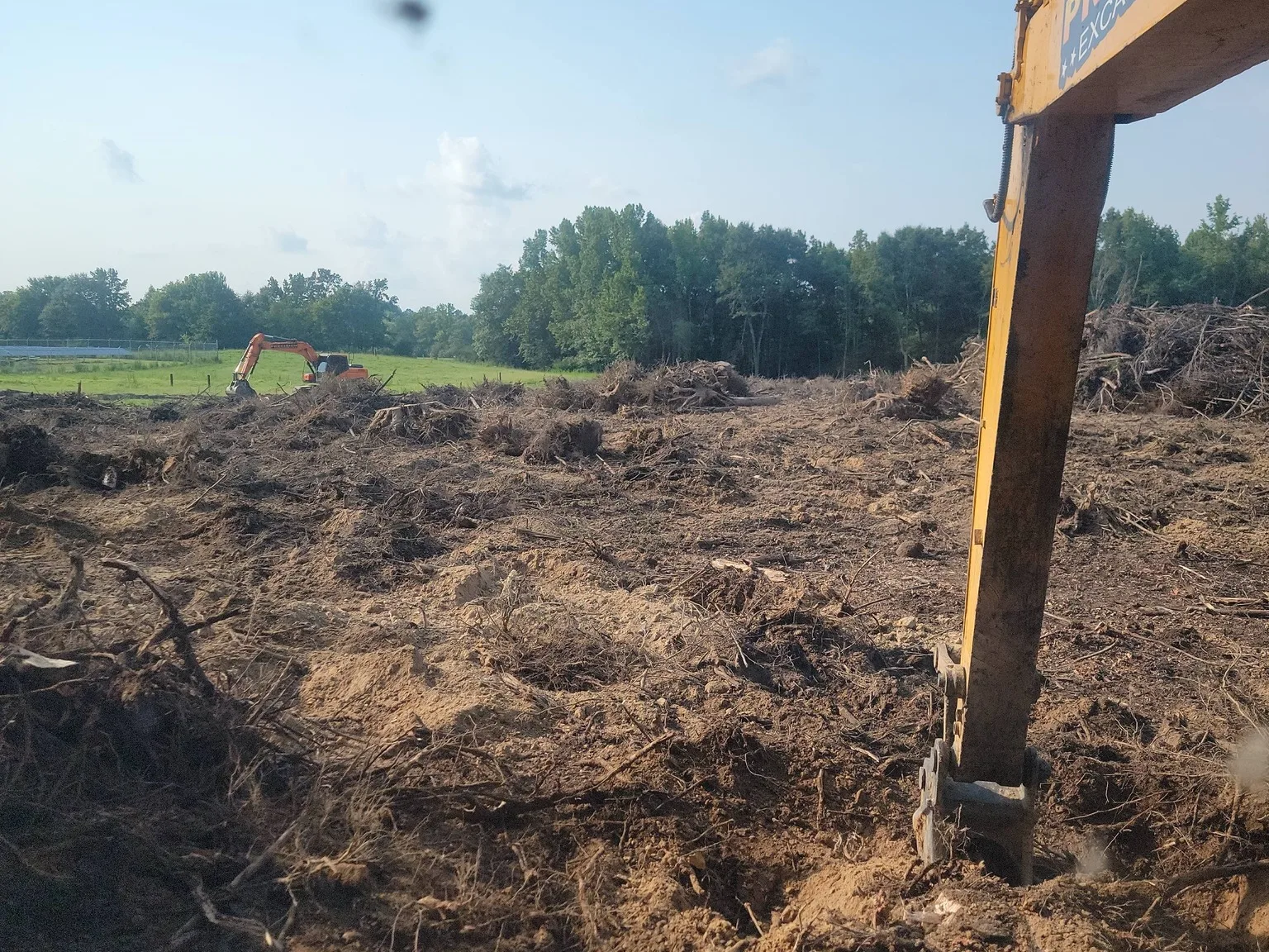 After: the same five acres cleared to dirt