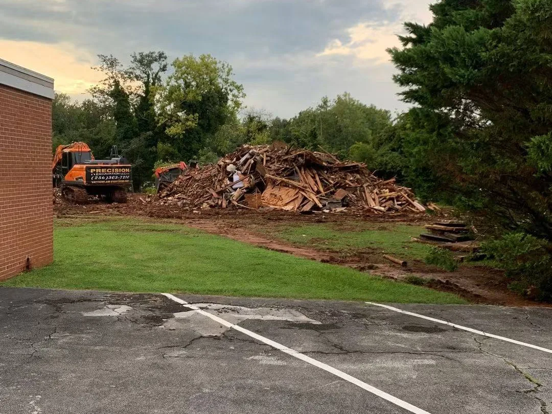 Demolition debris piled beside the building for loading
