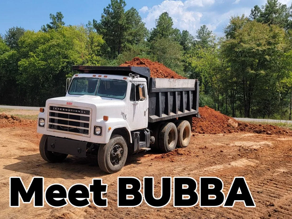 Our site dump truck loaded with red dirt