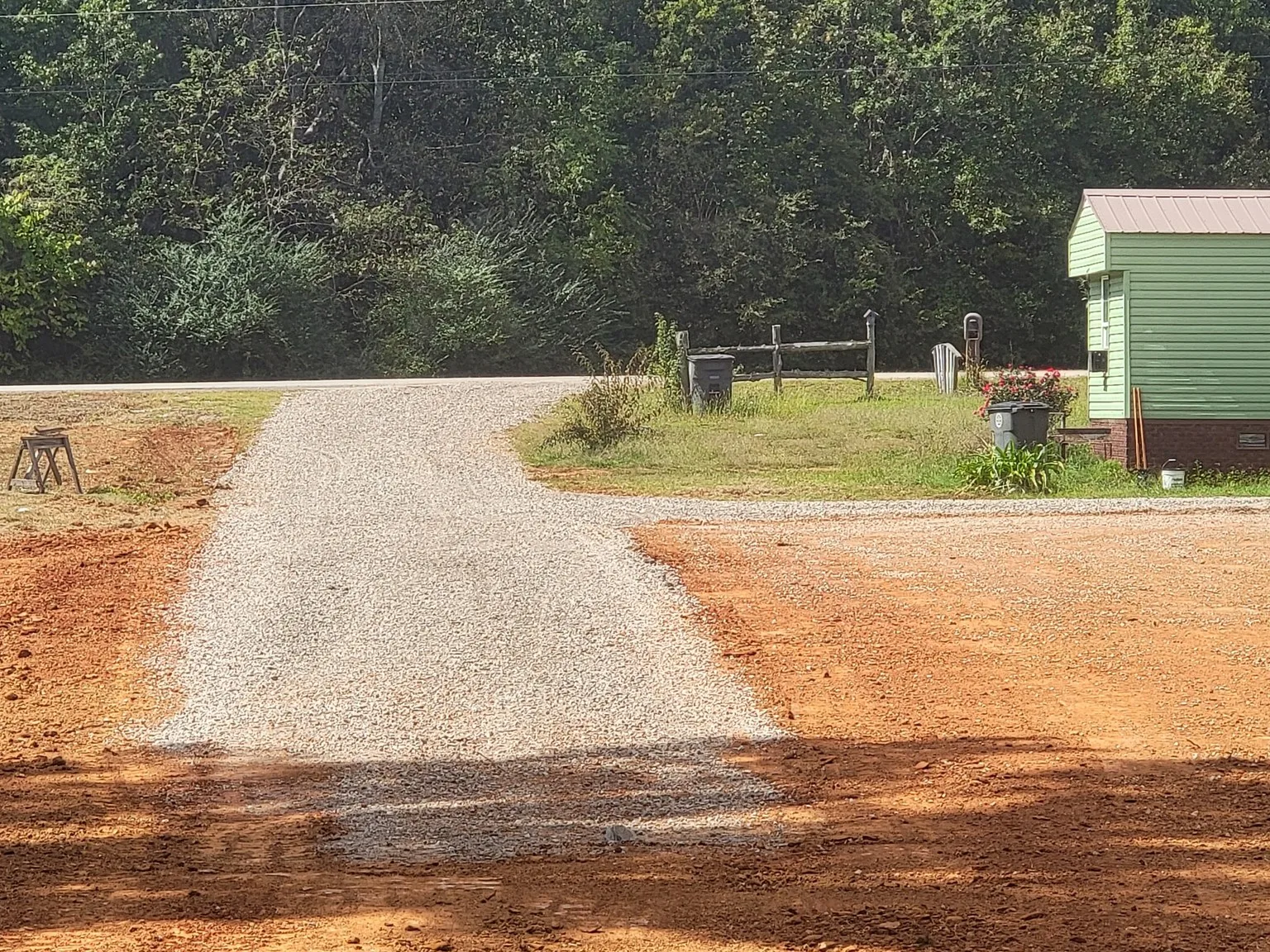 Gravel drive running to a new pad