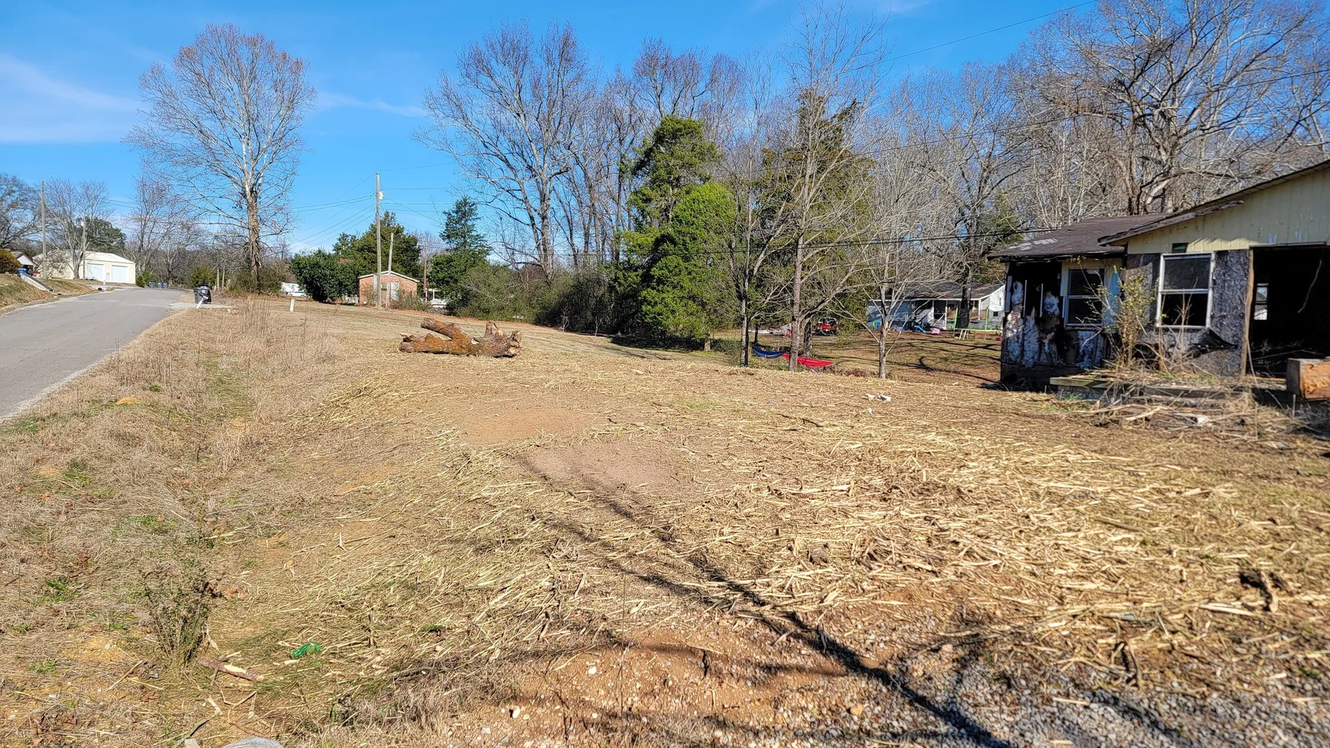 Site after the house was pushed down and the lot mulched