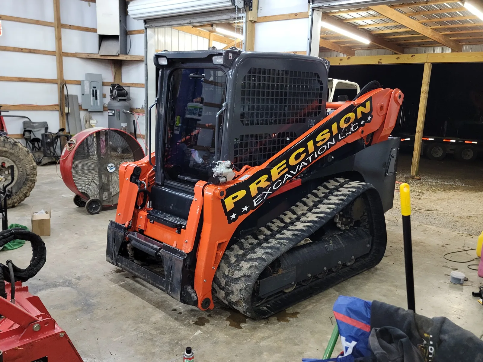 Skid steer and mulcher head washed and loaded for the next job