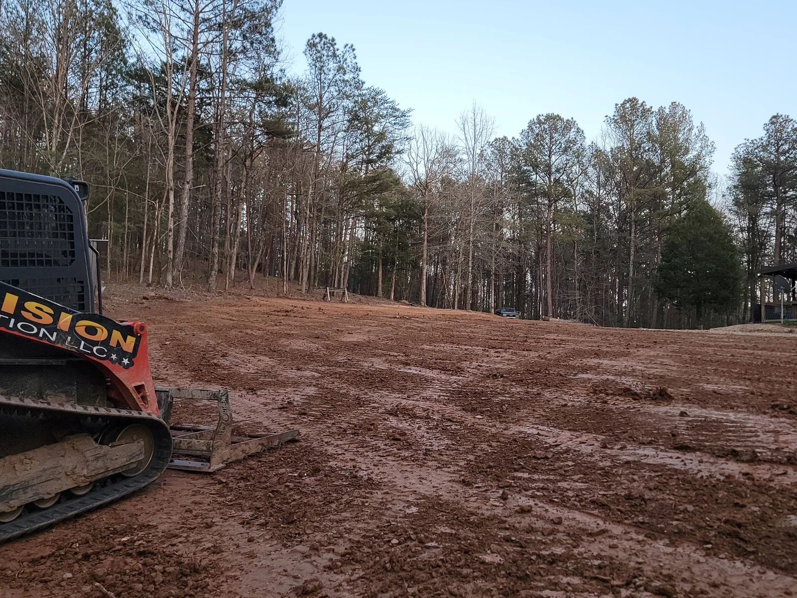 Yard cleared a hundred feet around a house in the forest